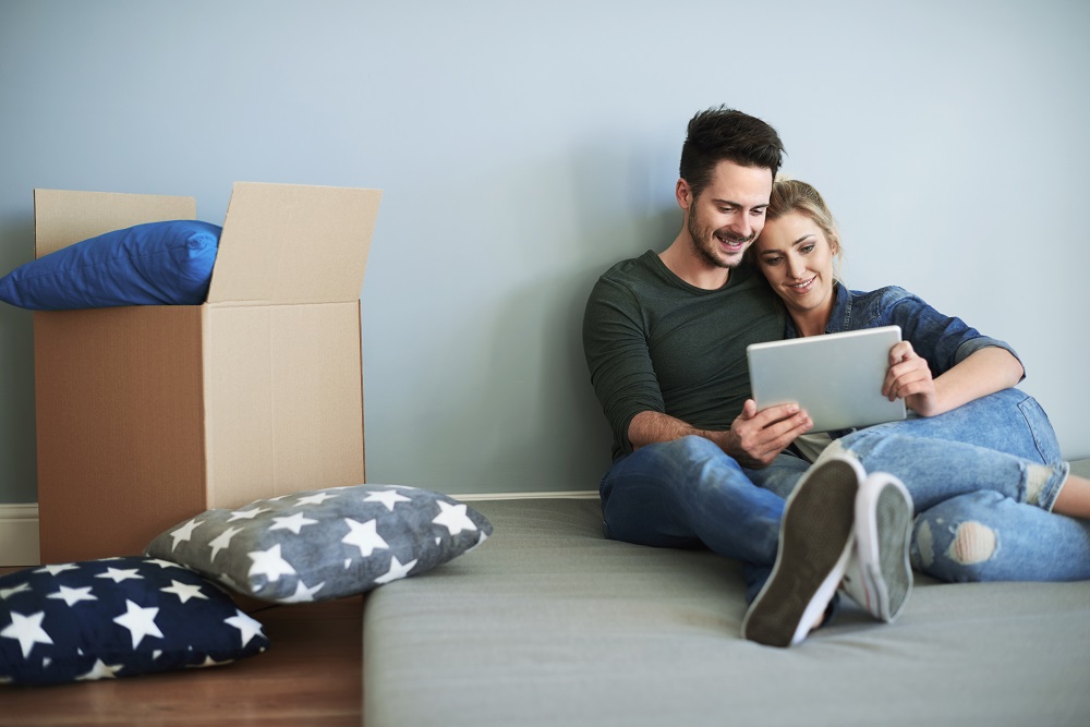 Young couple in their new house making decisions on sustainable house products and services.